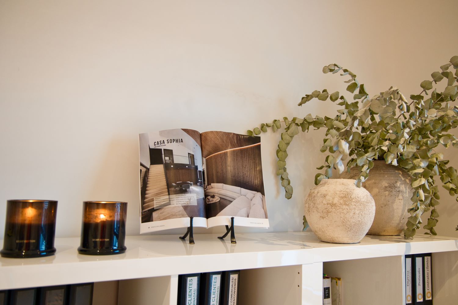 A magazine displaying Casa Sophia within the living room of Casa Sophia Passive House automated by Loxone.